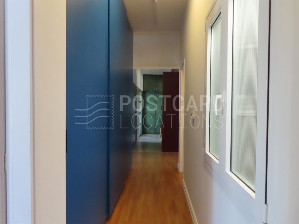 Bright and colorful open-plan space in 1980s apartment block