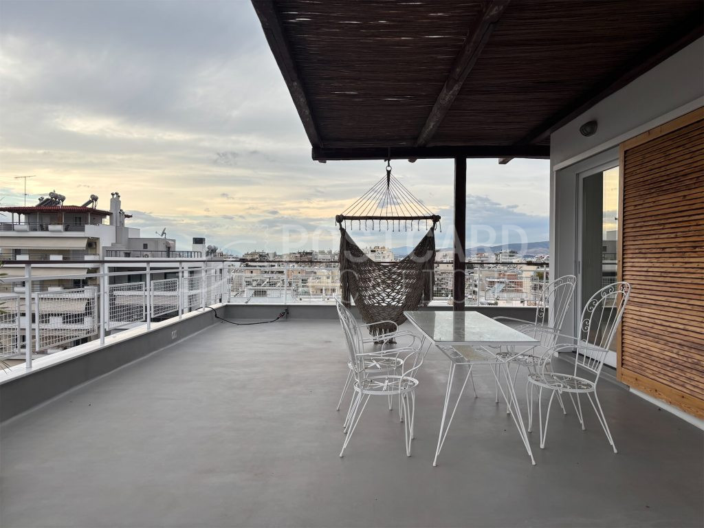 Island-inspired penthouse with large balcony and city views