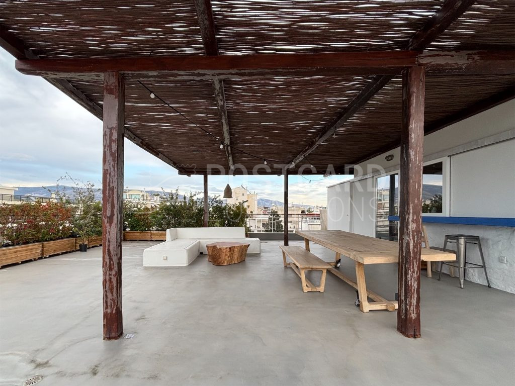 Island-inspired penthouse with large balcony and city views